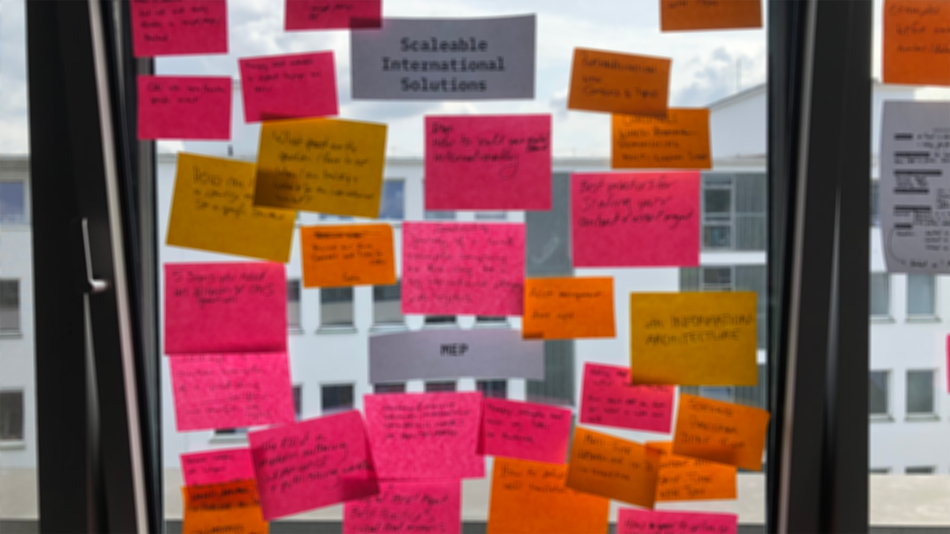 Window of post-its at an OSP workshop
